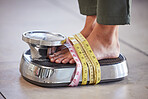 Diet, weight loss and feet of a woman on a scale for body check, measure and balance to lose weight on the floor. Obesity, scales and girl with tape measure for obsession with health and body image