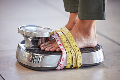 Buy stock photo Diet, weight loss and feet of a woman on a scale for body check, measure and balance to lose weight on the floor. Obesity, scales and girl with tape measure for obsession with health and body image