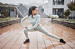 Rain, outdoor fitness and runner stretching for winter exercise, health training or start workout. Warm up, water drop and black woman focus with headphones for listening to music, podcast or radio
