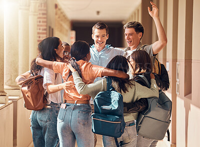 Buy stock photo Group of people, happy students and hug for education celebration, interracial support or study project success. Diversity, university friends celebrate  and hugging happiness in building corridor