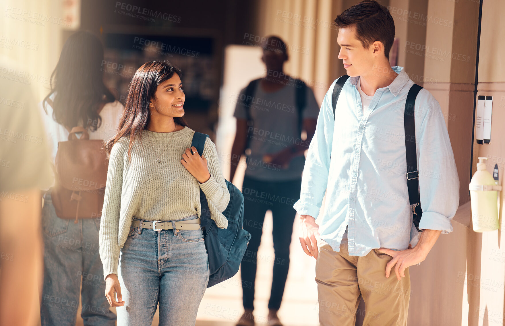 Buy stock photo Students, man or woman walking in hallway of school, university or college campus for education, global learning or study bonding. Smile, happy or scholarship friends talking and future success goals