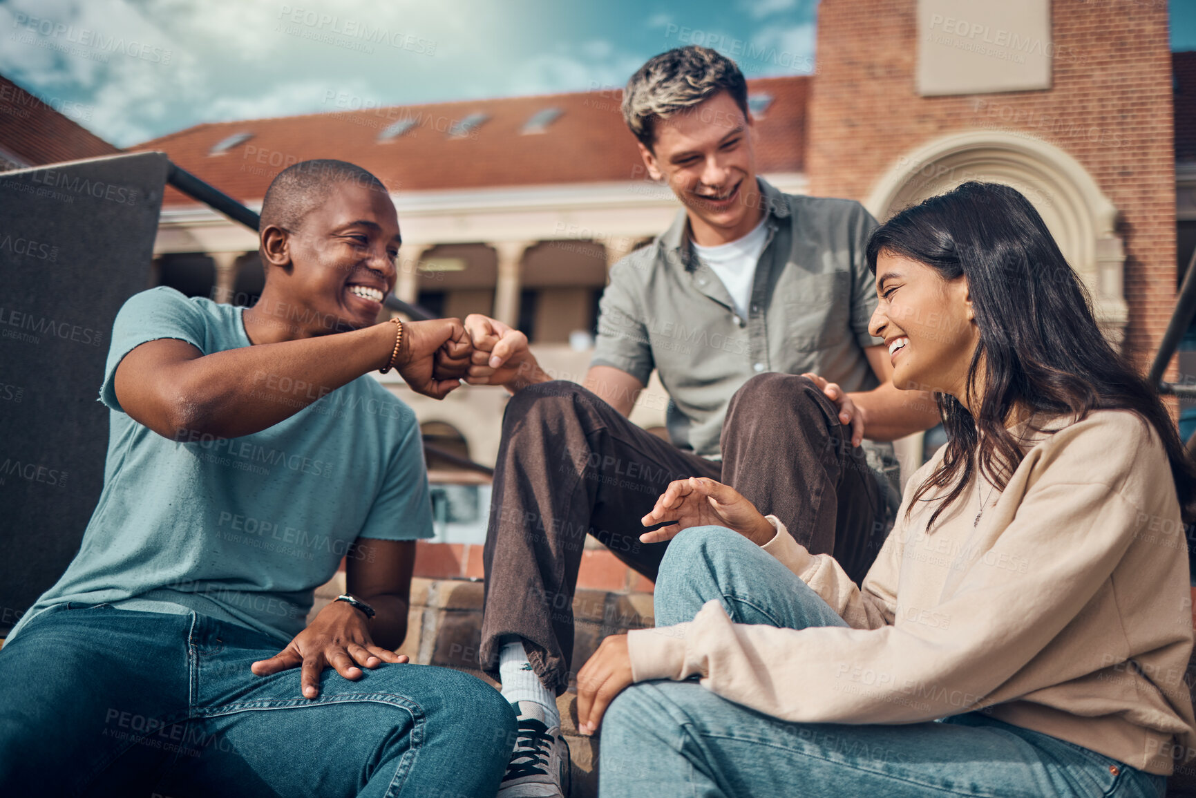 Buy stock photo Fist bump, greeting and students at college with diversity, education support and teamwork at school on campus. Excited, goals and friends speaking about scholarship, studying and deal at university