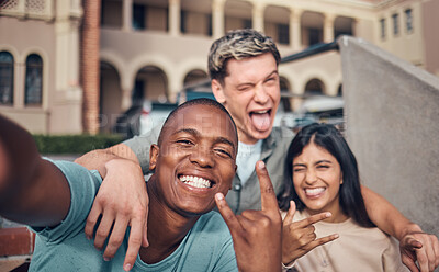 Buy stock photo Friends selfie, smile and portrait on university campus with diversity, happy and funny face, hand gesture and rock sign. Happy, portrait and interracial college friendship, students and photograph 