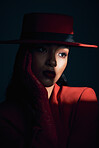 Beauty, art and fashion of aesthetic woman in studio with dark shadow, makeup and cosmetics for retro or vintage show girl background. Face of 90s female model with hat and classic style on black