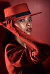 Fashion, retro and black woman in beauty and sexy portrait, red aesthetic with dark mystery, seductive and makeup. Vintage, style with lace fashionable glove, edgy and cosmetic against red background