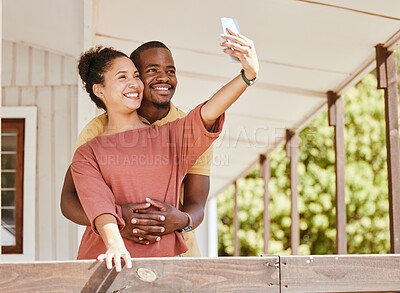 Buy stock photo Love, phone selfie and black couple in home by balcony, bonding and having fun. Romance, hug and man and woman taking pictures on mobile smartphone for happy memory, social media or profile picture.