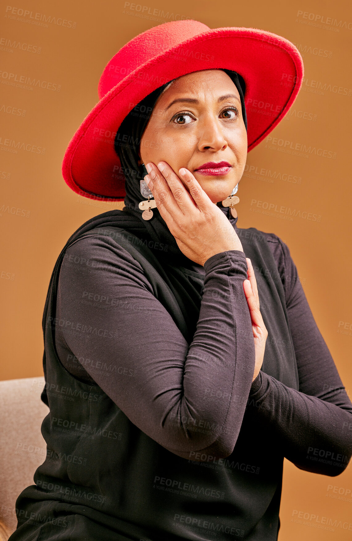 Buy stock photo Fashion, stylish and senior Muslim woman with beauty, elegant clothes and vintage on a brown studio background. Designer clothing, classy and face portrait of an elderly model with fancy elegance