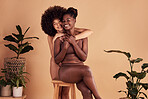 Hug, love and African women in underwear for fashion, body positivity and celebrate confidence on an aesthetic studio background. Happy, lingerie and portrait of model friends with affection for body