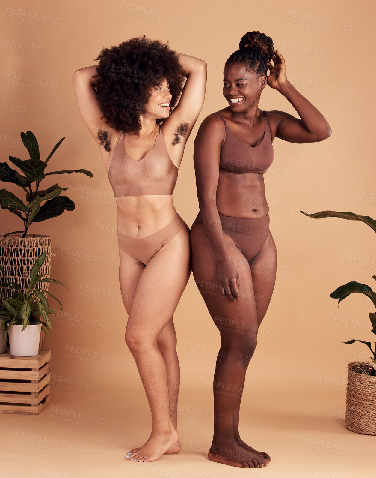 Buy stock photo Diversity, body and natural with black woman friends in studio on a beige background for beauty or equality. Health, wellness and armpit hair with a model female and friend posing in underwear