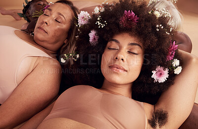 Buy stock photo Flowers, sleep and face of women in studio relaxing for peace, beauty or zen. Floral makeup, organic cosmetics and diversity of body positive group of friends in underwear sleeping together on floor.