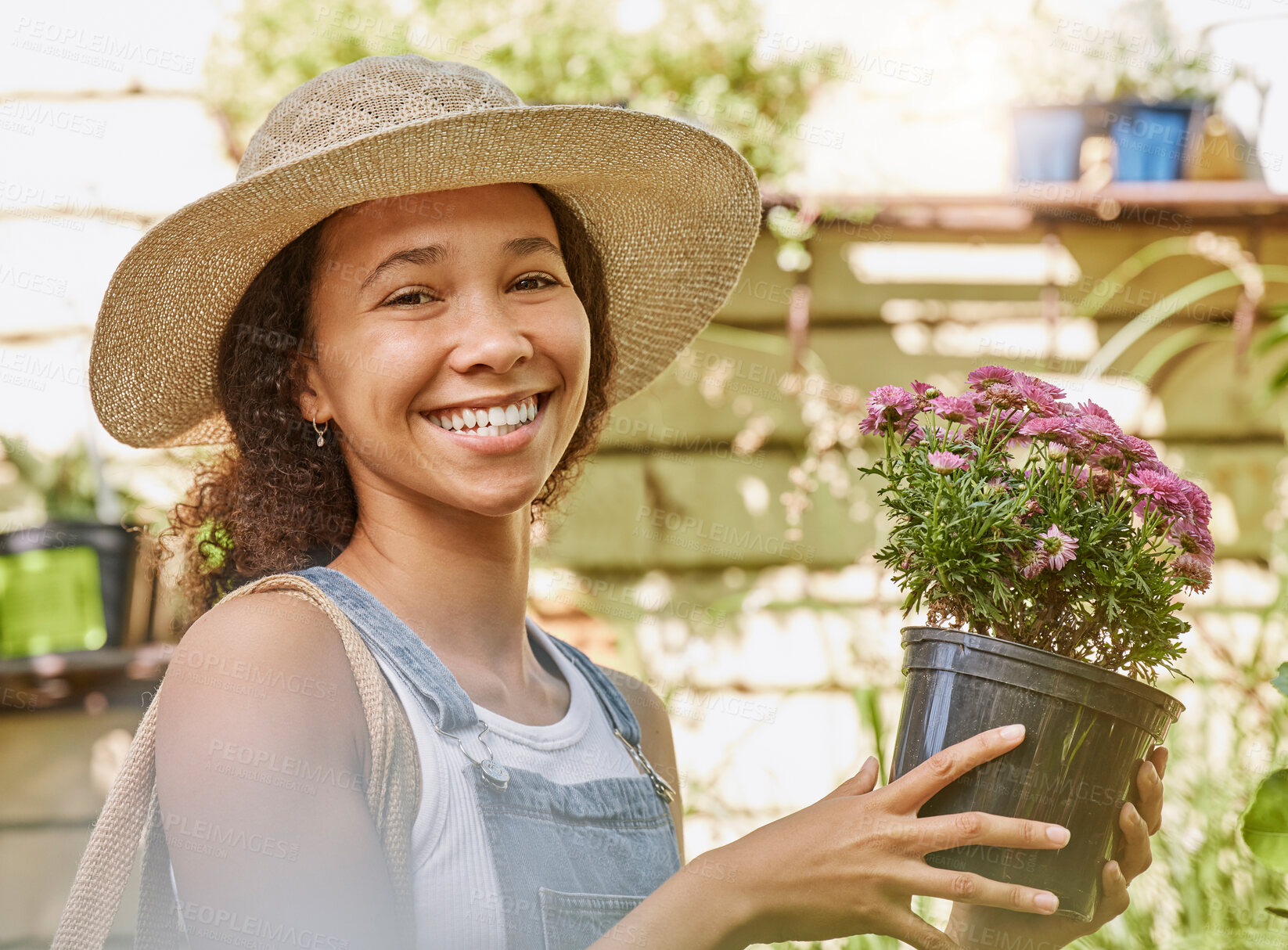 Buy stock photo Face, flower pot and black woman shopping in floral shop or nursery. Portrait, sustainability and happy female gardener from South Africa with beautiful flowers after buying at plant store or market.