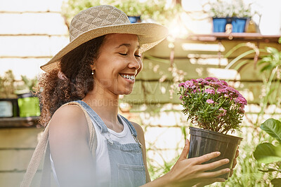 Buy stock photo Woman, smile and flower pot plant while shopping at florist shop for buying gardening plants at a nursery and garden store. Black female or happy customer with flowers for sale in a greenhouse