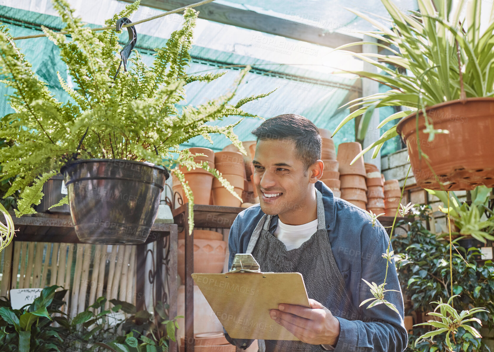 Buy stock photo Plant, nursery and small business man writing on checklist for quality control, growth and development in a gardening shop with pot plants. Male working at eco startup as seller of garden inventory