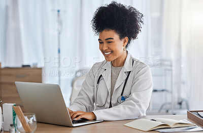 Buy stock photo Black woman, doctor and laptop with smile for healthcare, email or telemedicine by work desk at the hospital. African American female medical expert smiling on computer in medicare research at clinic