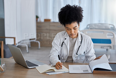 Buy stock photo Black woman, laptop and doctor writing in notebook for healthcare test, study or research at the hospital. African American female medical expert taking notes in book for insurance, report or results