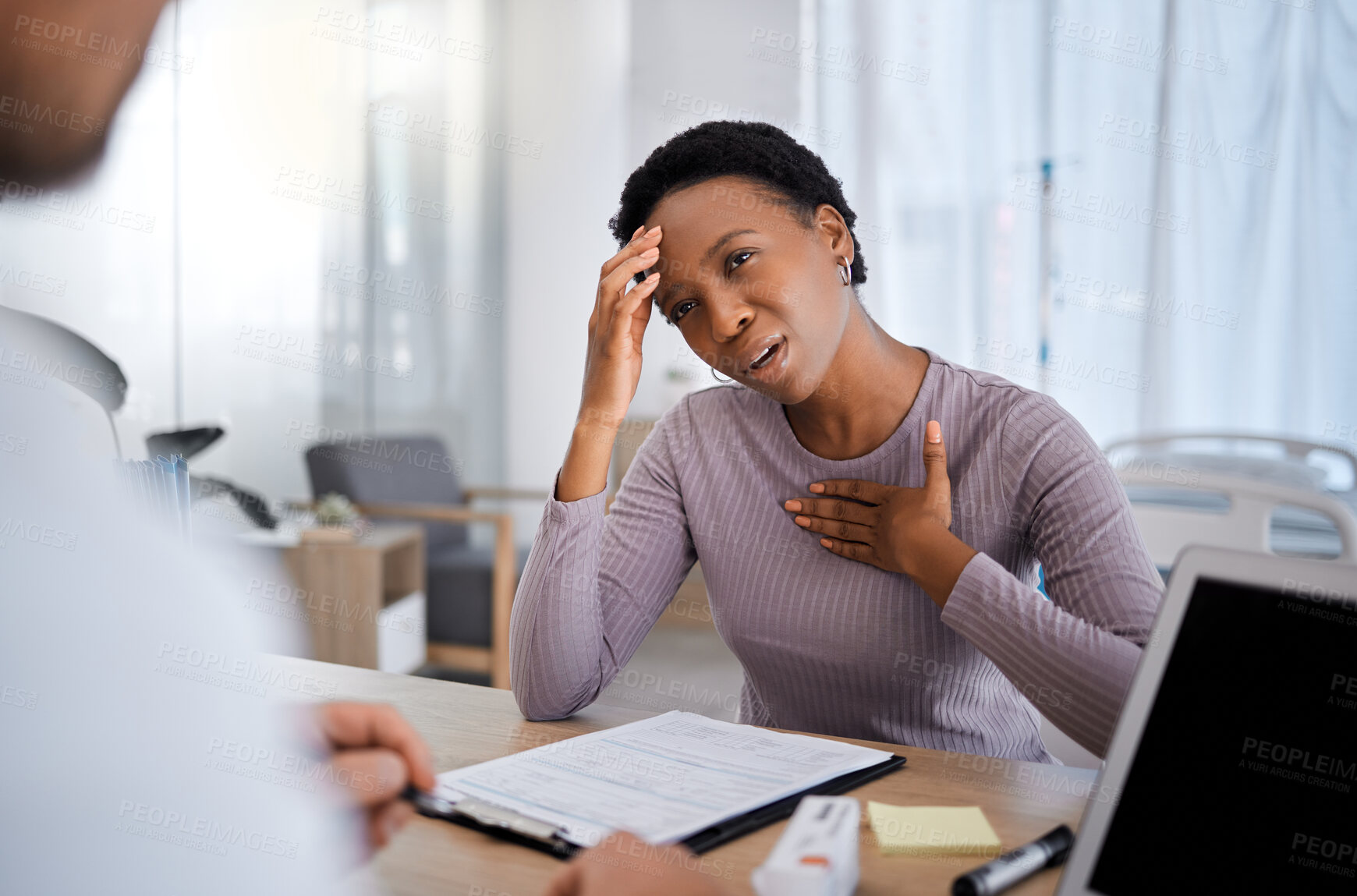 Buy stock photo Black woman, doctor consultation and pain in chest, headache and explain for help, advice or medicine. African woman, patient and gesture to medic, nurse or healthcare expert for support in Atlanta