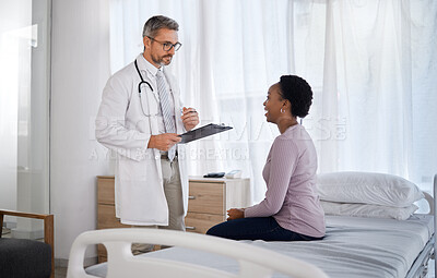 Buy stock photo Consulting, medical and doctor with black woman in hospital for checklist, examination and therapy. Appointment, interview and help with healthcare worker listening to patient for physician checkup