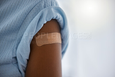Buy stock photo Covid, vaccine and plaster on the arm of a patient in a hospital after a booster shot for cure or treatment. Compliance, corona virus and healthcare with a person in a clinic for security regulations