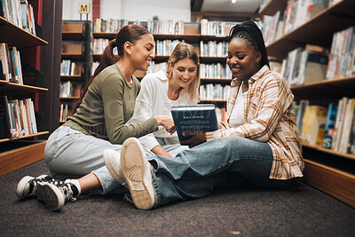 Buy stock photo Books, education and friends on a library floor for learning, research and homework assignment, happy and excited. Campus, women and university students bond on ground with book for exam preparation