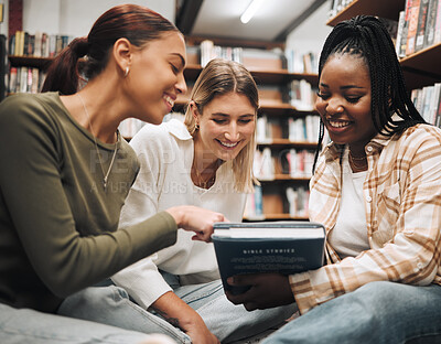 Buy stock photo Student, friends and book in school library for education, learning or knowledge together at university. Students smile for book club, books or information for research assignment or group project