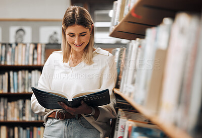 Buy stock photo Happy, reading or student in library for books, educational knowledge or research for learning or assessment. School girl, college or university student studying for insight or scholarship on campus