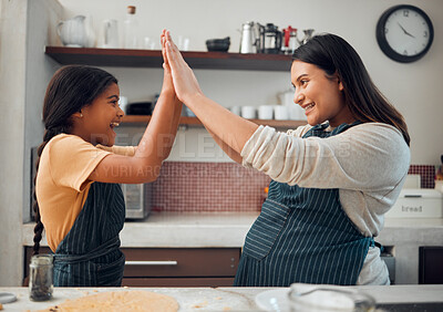 Buy stock photo Cooking, high five and success with mother and girl in kitchen for cookies, bonding and pregnancy. Help, happiness and achievement with pregnant woman baking with daughter for support, food and goal