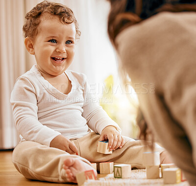 Buy stock photo Shot of a mom bonding with her adorable baby boy at home