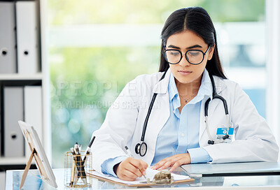 Doctor, insurance and medical of a woman filling out patient history for diagnosis at the hospital. Healthcare worker or nurse writing on paper with clipboard for health and wellness at the office.