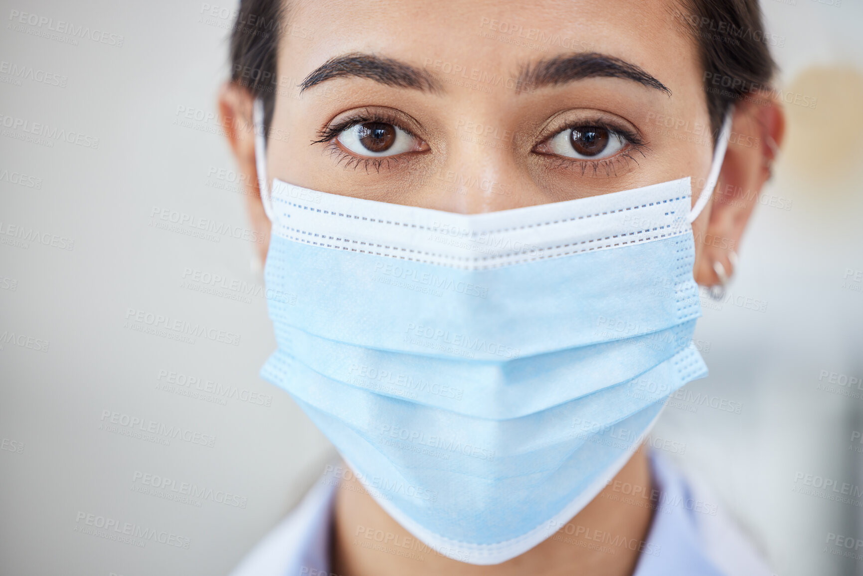 Buy stock photo Covid doctor with face mask for safety, medicine and hygiene while working in a medical hospital or clinic. Portrait of woman nurse, healthcare expert and professional worker in corona virus pandemic