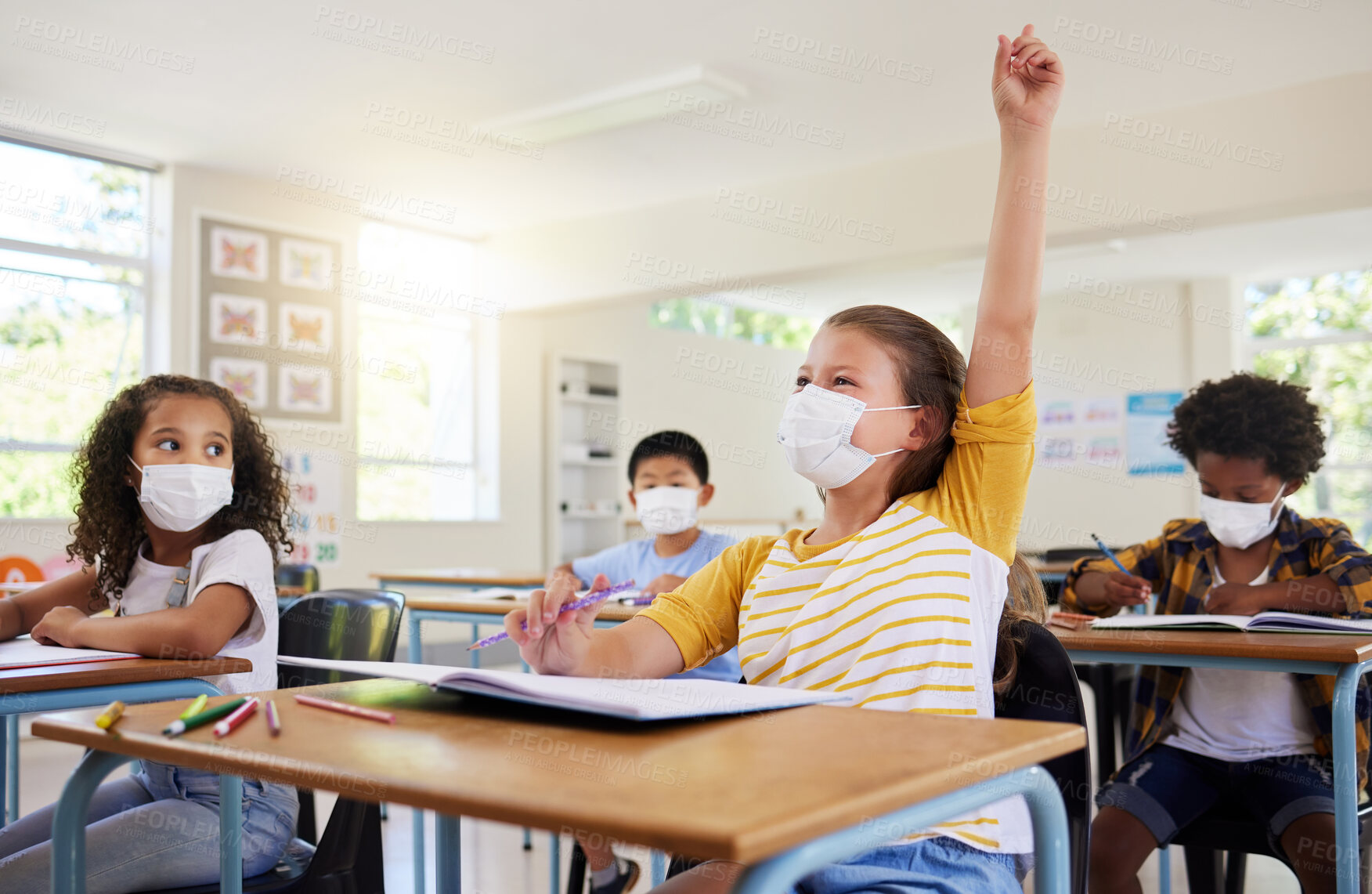 Buy stock photo Learning, education and classroom in covid pandemic with students wearing face mask for protection against the spread of the virus or diseases. Clean inside school with dedicated and smart children