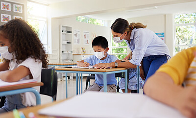 Buy stock photo Covid learning with teacher and school students having lesson, study and education in class during pandemic. Educator helping and checking workbook of young kindergarten, preschool and elementary kid