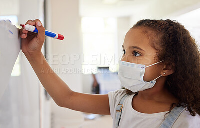 Buy stock photo School student writing on whiteboard in class during covid pandemic for learning, education and study. Young kindergarten, preschool or elementary kid with mask for safety, protection and protocol