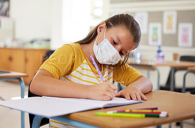 Buy stock photo School, education and learning with covid mask on girl face in classroom, writing or doing assignment alone. A dedicated, smart and disciplined learner in a lesson during pandemic while taking notes
