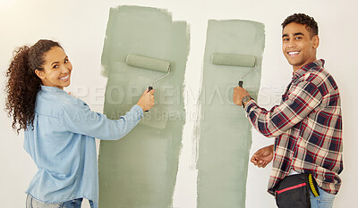 Buy stock photo Portrait of happy couple painting room or interior house renovation and home or property design project with smile, white wall background. New home or apartment and happy painter people and DIY paint