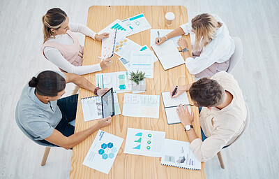 Buy stock photo Marketing, advertising and team planning, strategy and paperwork above in a meeting at the office. Design teamwork in collaboration, analytics and business graphs, charts and data on paper documents.