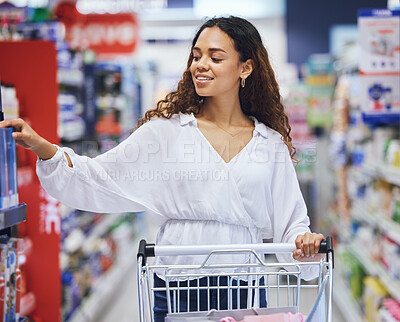 Buy stock photo Customer, shopper and consumer shopping for groceries in a supermarket store, mall shop or retail outlet. Happy woman pushing trolley in aisle to buy sale products, discount goods and brand offers