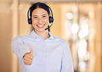 Woman thumbs up of crm, customer support and telemarketing agent. Success, achievement and support yes hand sign of a happy internet call center employee with headset ready for tech help consulting
