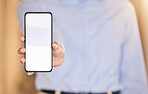 Marketing, advertising and digital phone mockup in the hands of a user for branding, message or text. Hand showing mobile device for copy paste, test apps or software UI display or screen design.