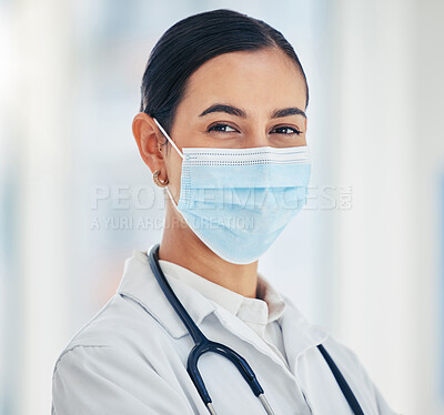 Buy stock photo Covid doctor with face mask for safety, medicine and hygiene while working in a medical hospital or clinic. Portrait of woman nurse, healthcare expert and professional worker in corona virus pandemic