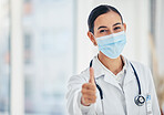 Thumbs up, mask portrait and doctor in agreement with healthcare procedure at hospital. Woman medical worker with yes hand gesture for satisfaction with safety protocol at care facility.