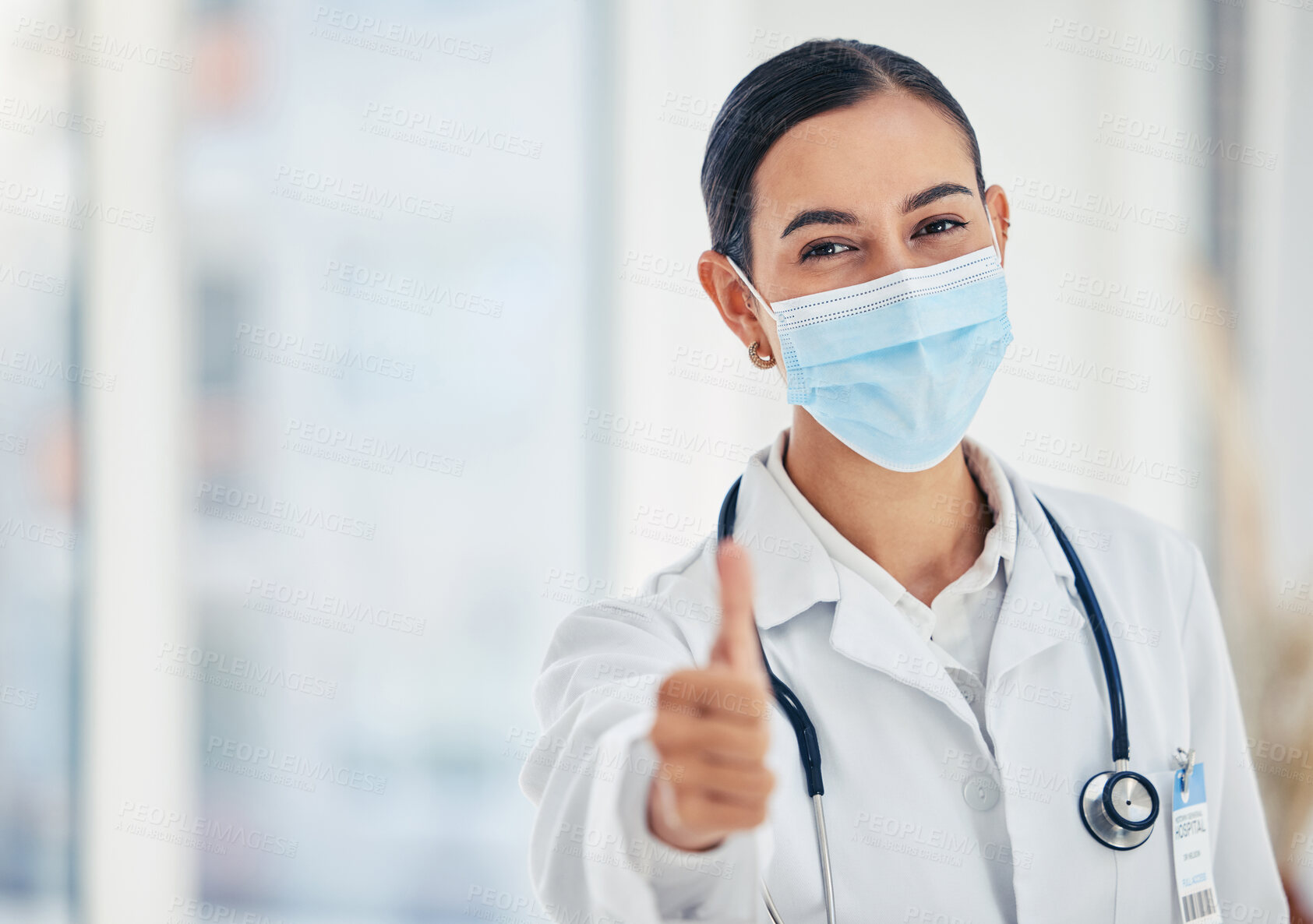 Buy stock photo Thumbs up, mask portrait and doctor in agreement with healthcare procedure at hospital. Woman medical worker with yes hand gesture for satisfaction with safety protocol at care facility.