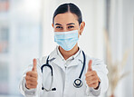 Covid, portrait and thumbs up doctor with mask happy with  hospital hygiene for infection safety. Healthcare woman with hand gesture of success for virus prevention in consultation room.