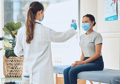 Buy stock photo Healthcare, compliance and covid scan by doctor and patient with digital thermometer in a consultation room. Healthcare worker checking for fever and corona symptoms, practice safety during pandemic