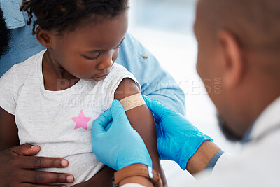 Buy stock photo Child, healthcare vaccine and doctor with plaster for skin protection after injection appointment. Black kid and medical worker with bandage for healing of wound from needle medicine immunity.