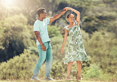 Buy stock photo Love, freedom and celebration by couple dancing outdoors, loving romantic getaway and bonding. Happy black man and woman being playful and sweet, enjoying their relationship and having fun together