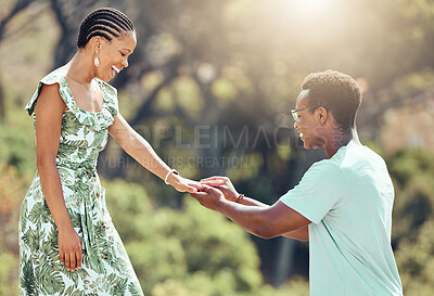 Buy stock photo Love, engagement and black man propose to girlfriend on romantic date outdoors, happy and excited. African woman surprise sweet gesture, enjoying special relationship moment on outdoor date together 