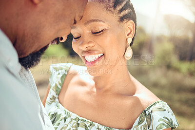 Buy stock photo Love, black couple and forehead touch in nature with a smile on holiday or date. Happy black man and woman, romantic African people or lovers bonding in affection together in the shining summer sun.
