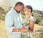 Black couple dancing in garden, park or nature together outdoors for love, relax and playful fun. African people, partners on a date and happy romantic marriage, intimate dance and care relationship
