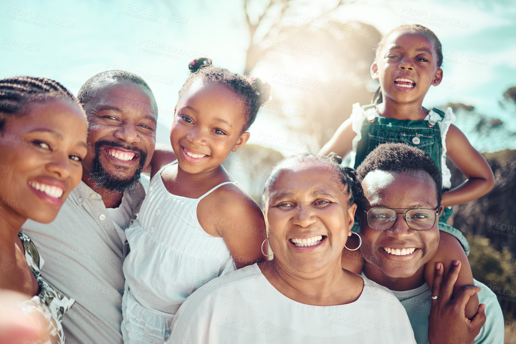 Buy stock photo Family, selfie and love with people taking a photograph with a smile together outside in summer. Self portrait of a happy group of children, parents and grandparents posing for a picture in the sun