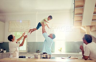 Buy stock photo Family happy, home and father love of a man with his child in the air playing in a house kitchen. Generation of men smile at home with a fun time together and relax and comic mindset with sun shining